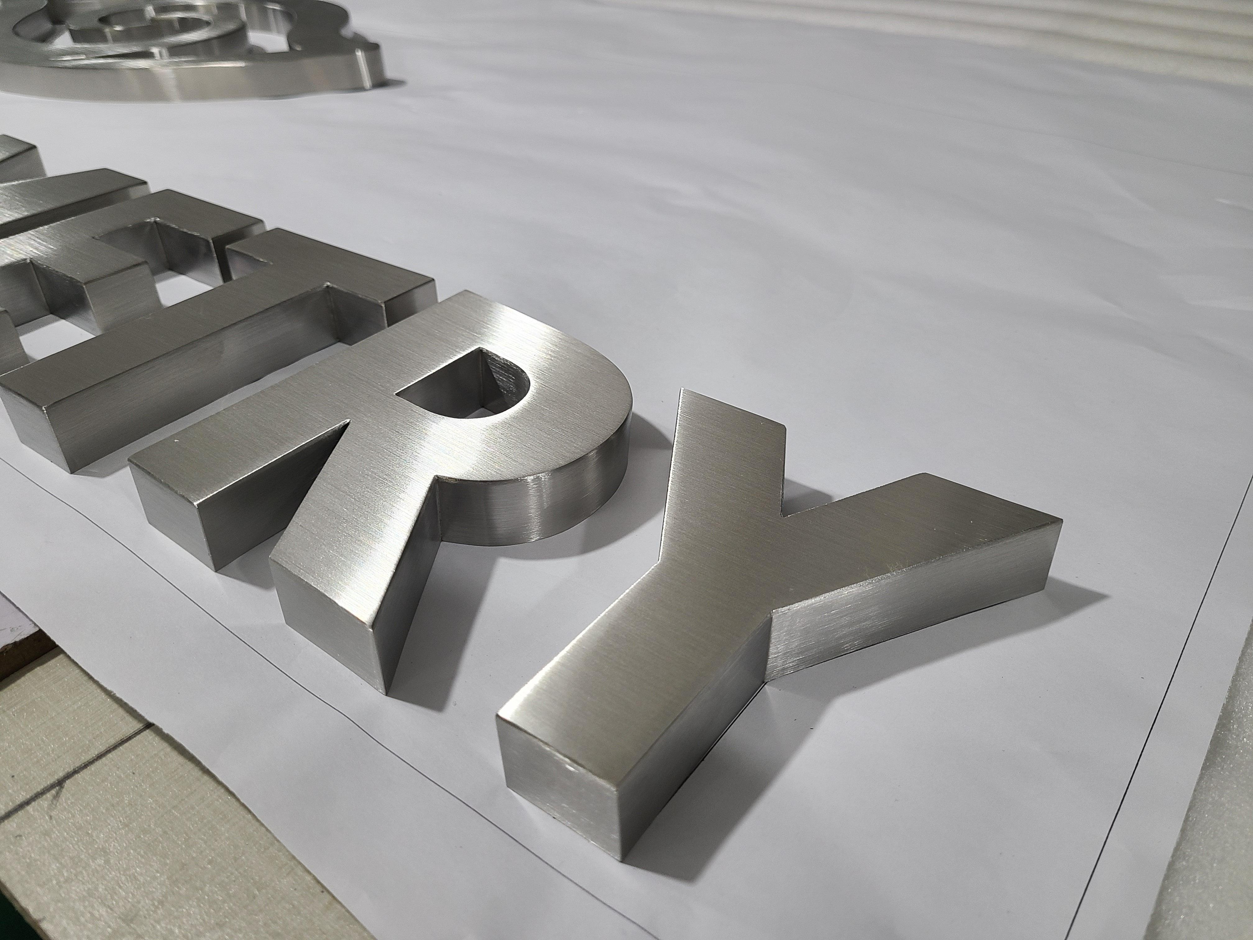 Custom brush finished stainless steel channel letters sign