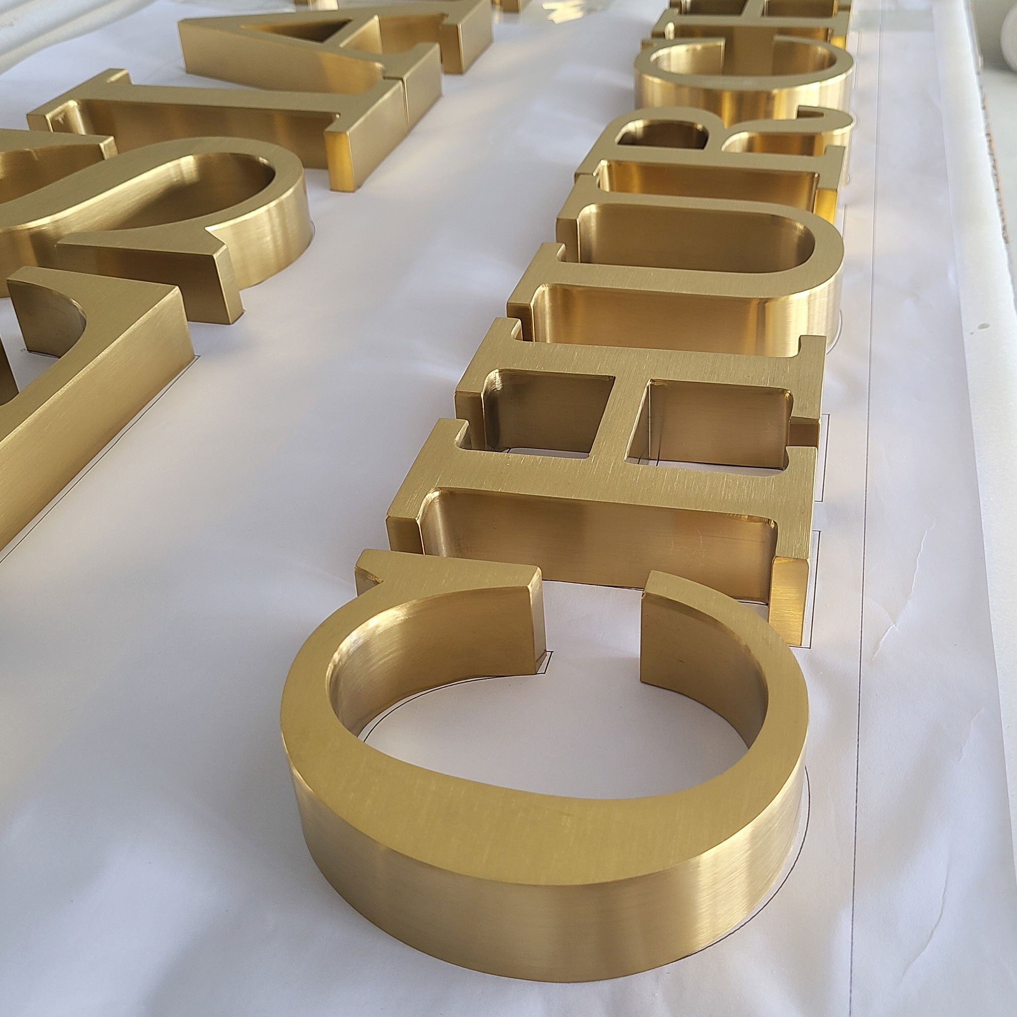 Customized Gold Brushed Building Sign – sunsignus
