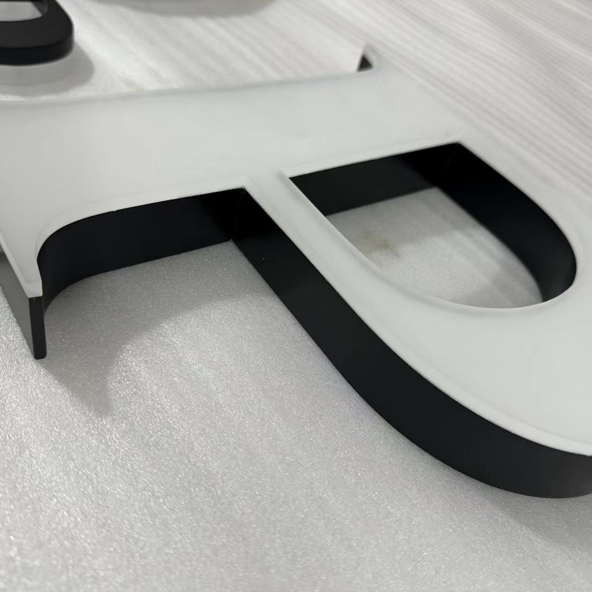 Custom painted stainless steel 3D letters reverse lit channel letters exterior company wall brand signs